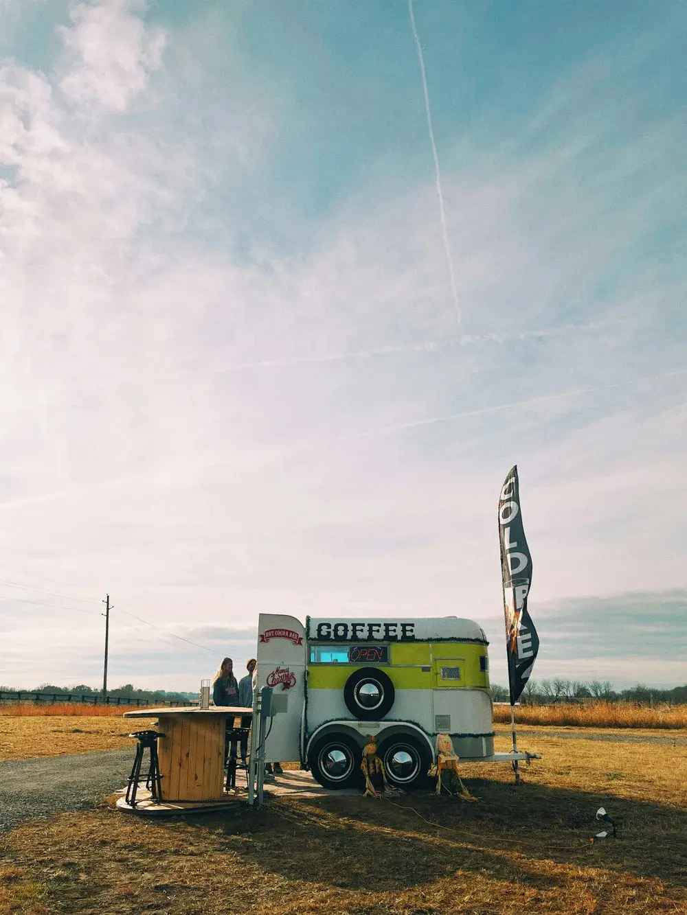 Vintage coffee trailer parked in a field